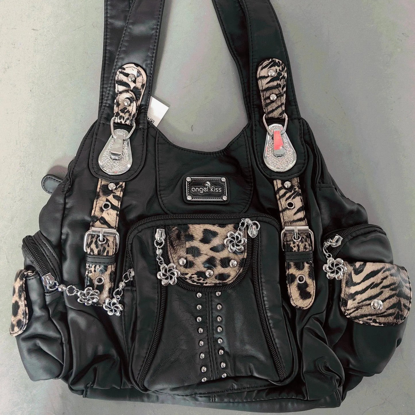 Redemption by Ashley North Angel Kiss large hobo bag in soft PU leather with adjustable strap, multiple pockets, and anti-theft zipper.