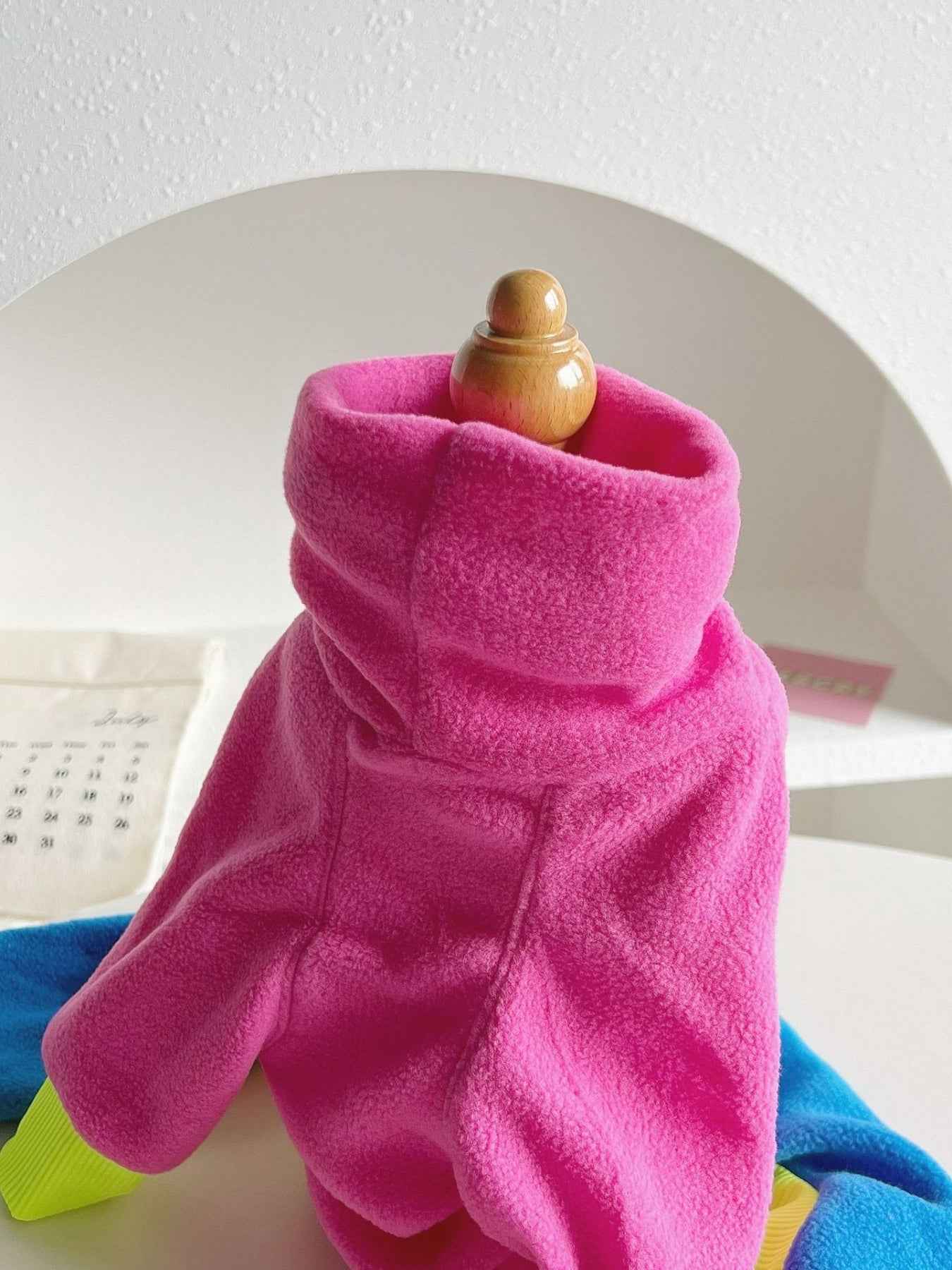 Hot pink outdoor dog jacket by All Sorts Co. designed for large dogs, providing warmth and protection in outdoor conditions.