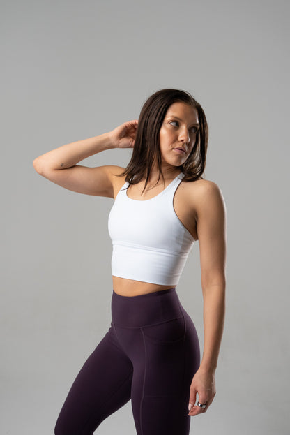 Black Alyth Active rebellious crop bra made of stretchy fabric, shown on a small-sized mannequin.