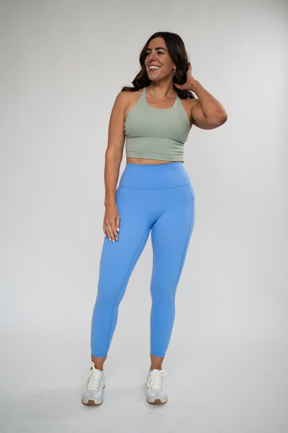 Black Alyth Active rebellious crop bra shown on mannequin, highlighting its sporty design and comfortable fit.