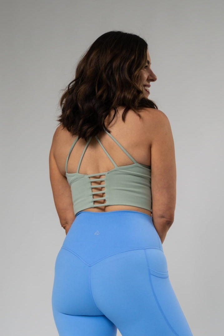Black Alyth Active Rebellious Crop Bra displayed on a mannequin, showcasing its stylish, snug fit and sporty design.
