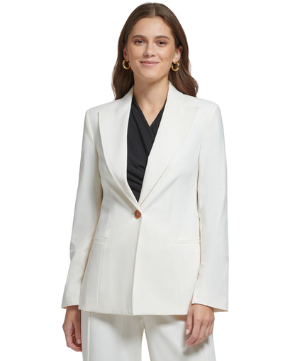Beige DKNY women's long-sleeve blazer with peak collar and single button, stylish women's clothing by Amber Chrysippus.
