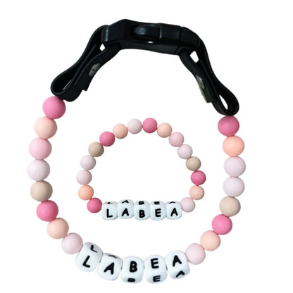 Personalized pet collar and matching bracelet set from PawBond™ in colorful design, suitable for 18-21 inch pets and matching accessories.