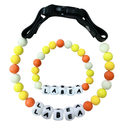 Personalized PawBond pet collar and matching bracelet set in colorful design, featuring paw prints for pets and owners.