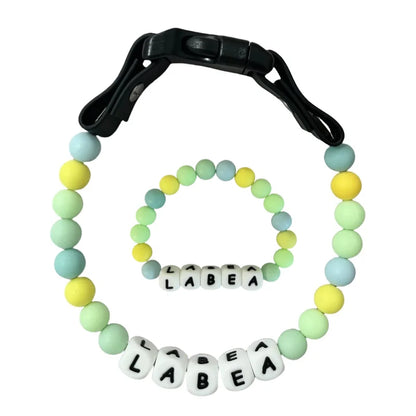 Personalized PawBond pet collar and matching bracelet set in vibrant colors, featuring paw print design for pets and owners.