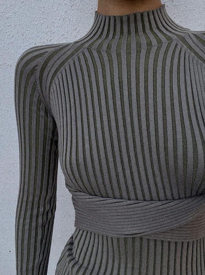 Azure Thanatos Malika Knit Dress in ivory, shown on a model, featuring a fitted design and soft knit fabric for a stylish look.