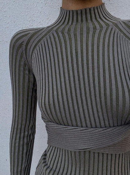 Azure Thanatos Malika Knit Dress in ivory, shown on a model, featuring a fitted design and soft knit fabric for a stylish look.