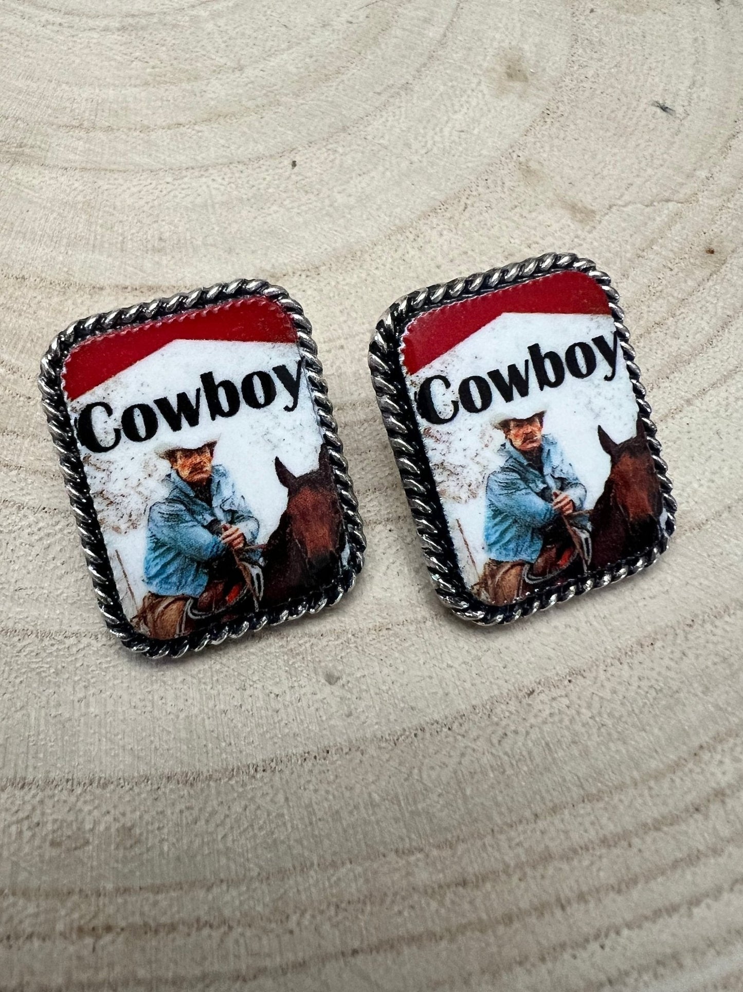 Western cowboy cigarette earrings by Cowhide and Conchos, petite 1-inch fashion jewelry featuring cowhide and concho accents.
