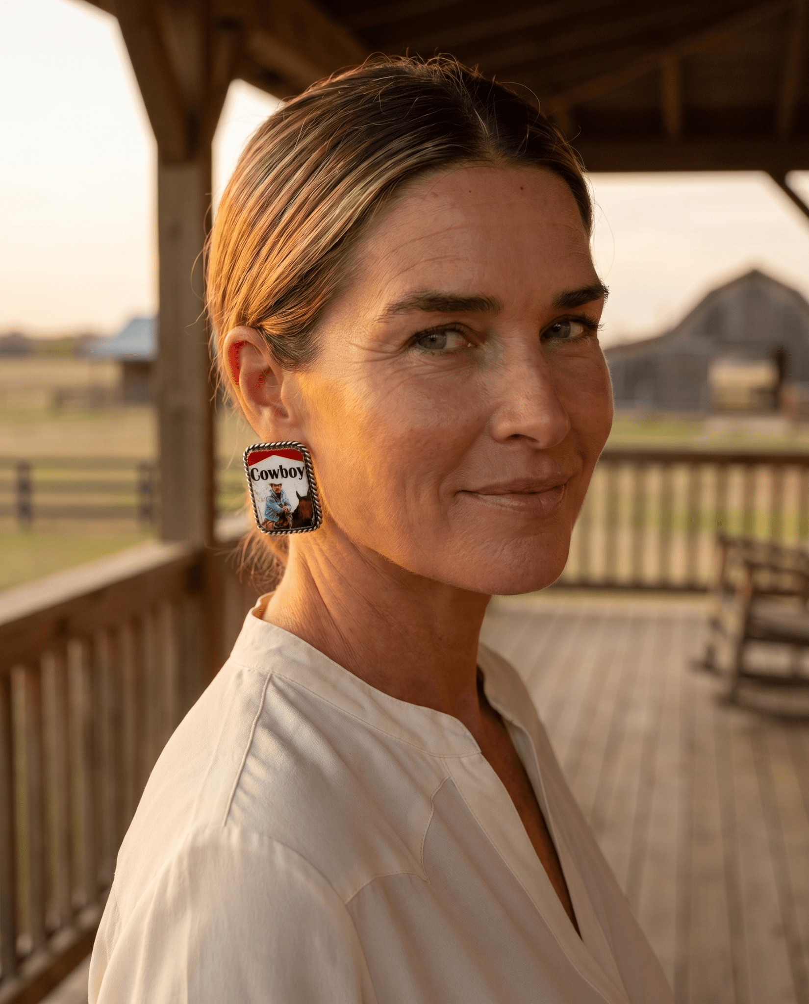 Western cowboy cigarette earrings by Cowhide and Conchos, petite 1-inch statement jewelry featuring cowhide and concho accents.