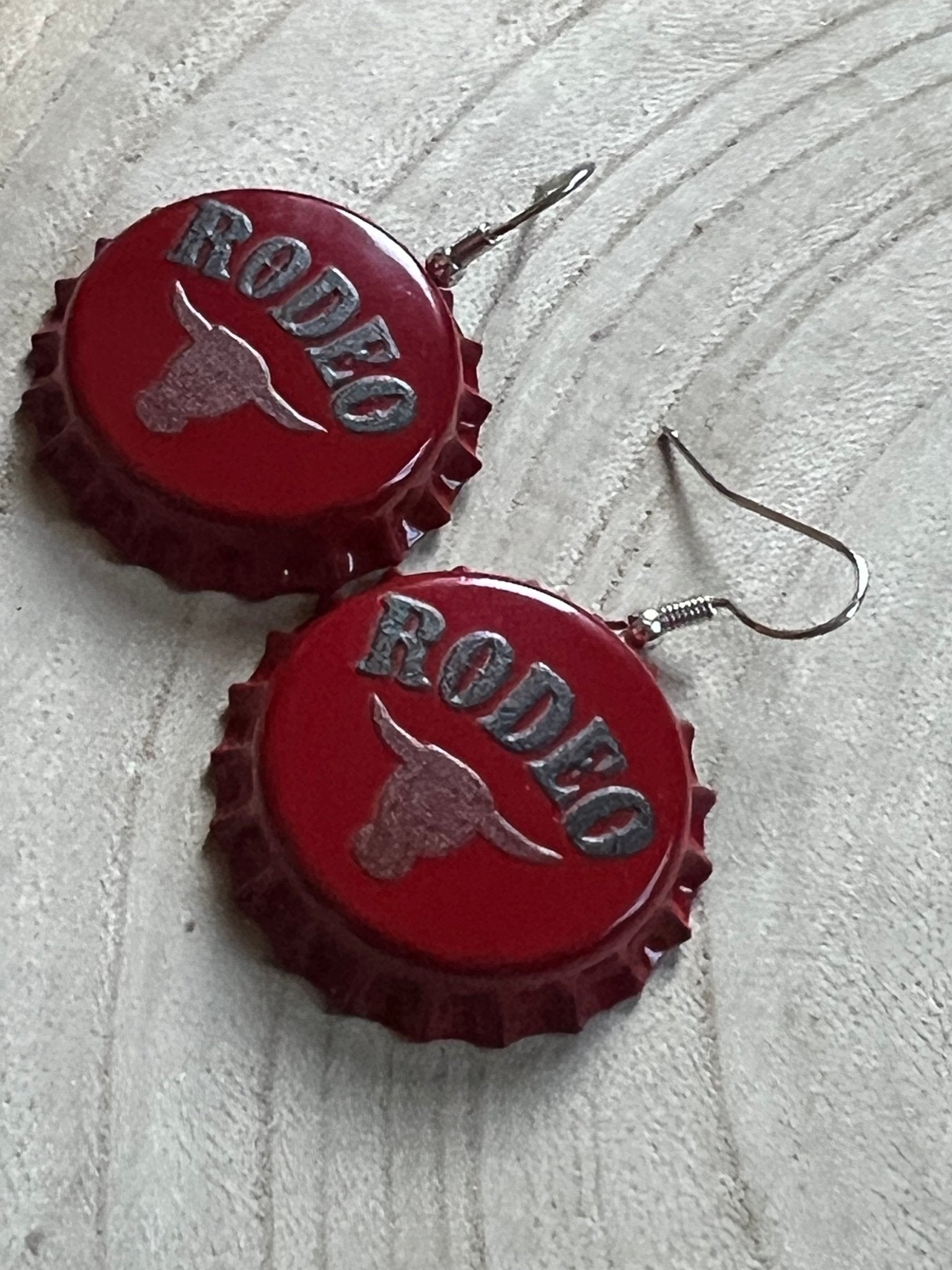 Western Rodeo Steer Head Beer Cap Earrings featuring bull motif, cowhide accents, and Western statement jewelry by Cowhide and Conchos.