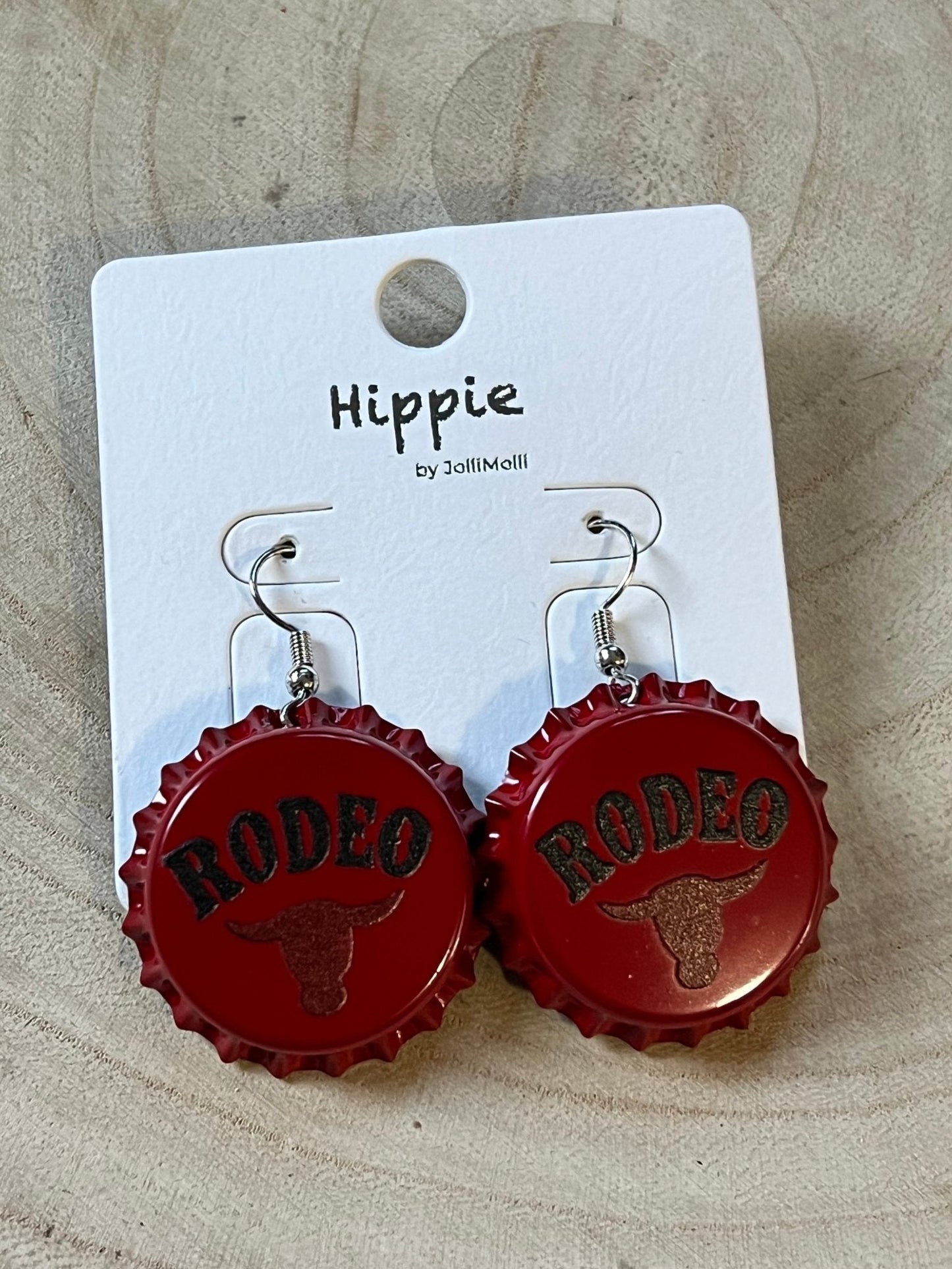 Western Rodeo Steer Head earrings by Cowhide and Conchos featuring bull motif and cowhide accents, Western statement fashion jewelry.