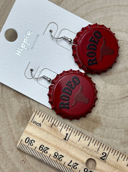 Western Rodeo Steer Head Beer Cap Earrings featuring bull motif, cowhide accents, and Western statement jewelry by Cowhide and Conchos.