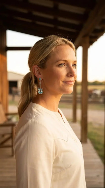 Western turquoise guitar dangle earrings by Cowhide and Conchos featuring cowhide accents and a 2-inch drop, perfect for country music style.