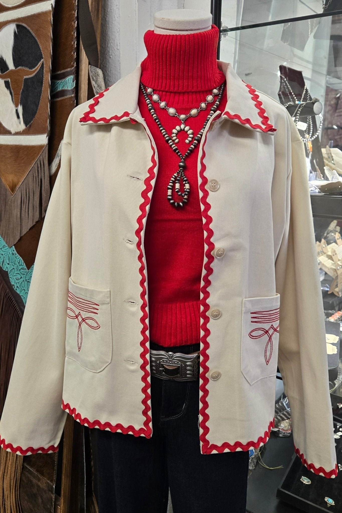 Red sleeveless turtle neck sweater top for women by Cowhide and Conchos, featuring a fitted design and smooth fabric.