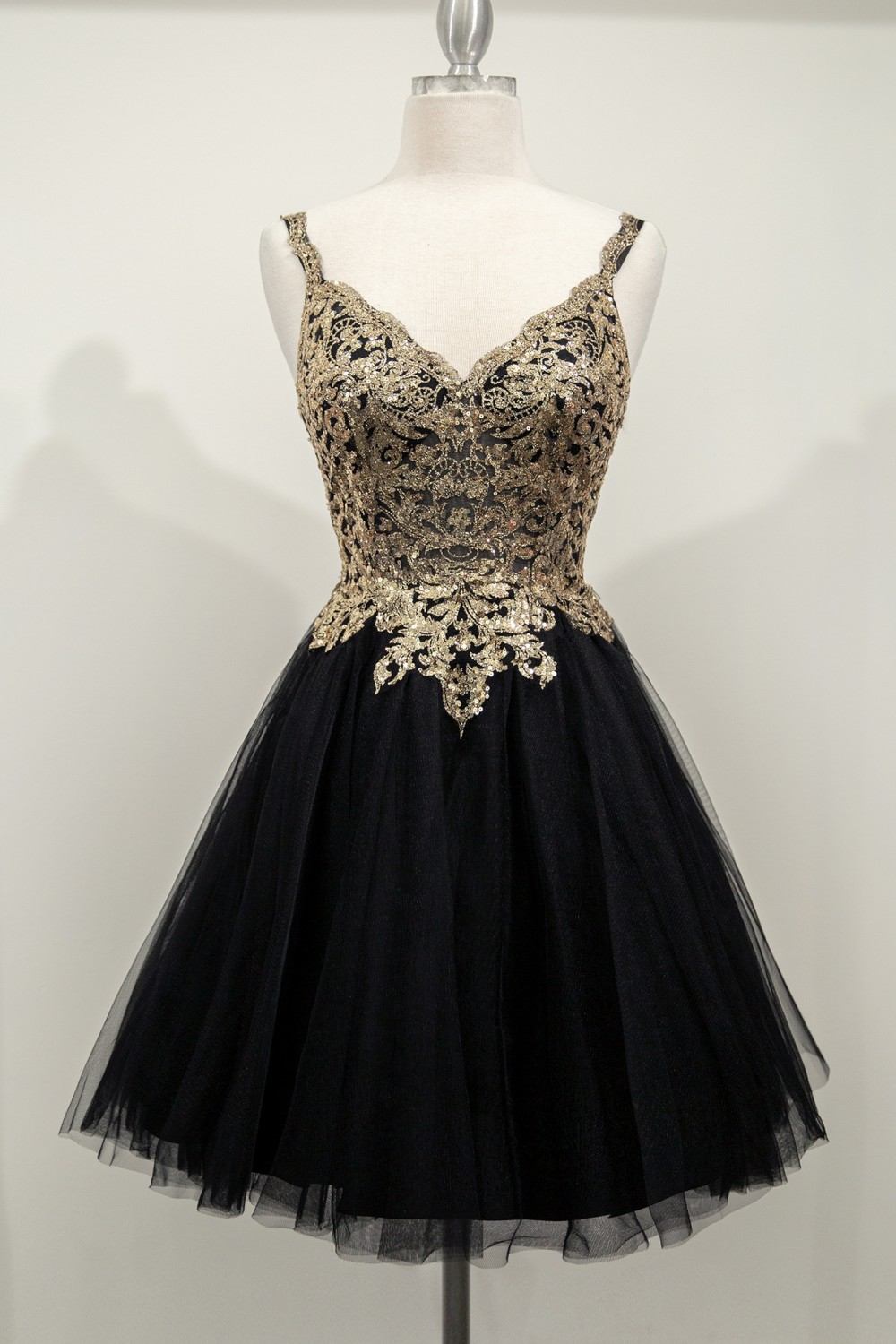 Champagne gold Cinderella Divine 9239 short poofy layered A-line gown with a tulle skirt, perfect for elegant occasions.