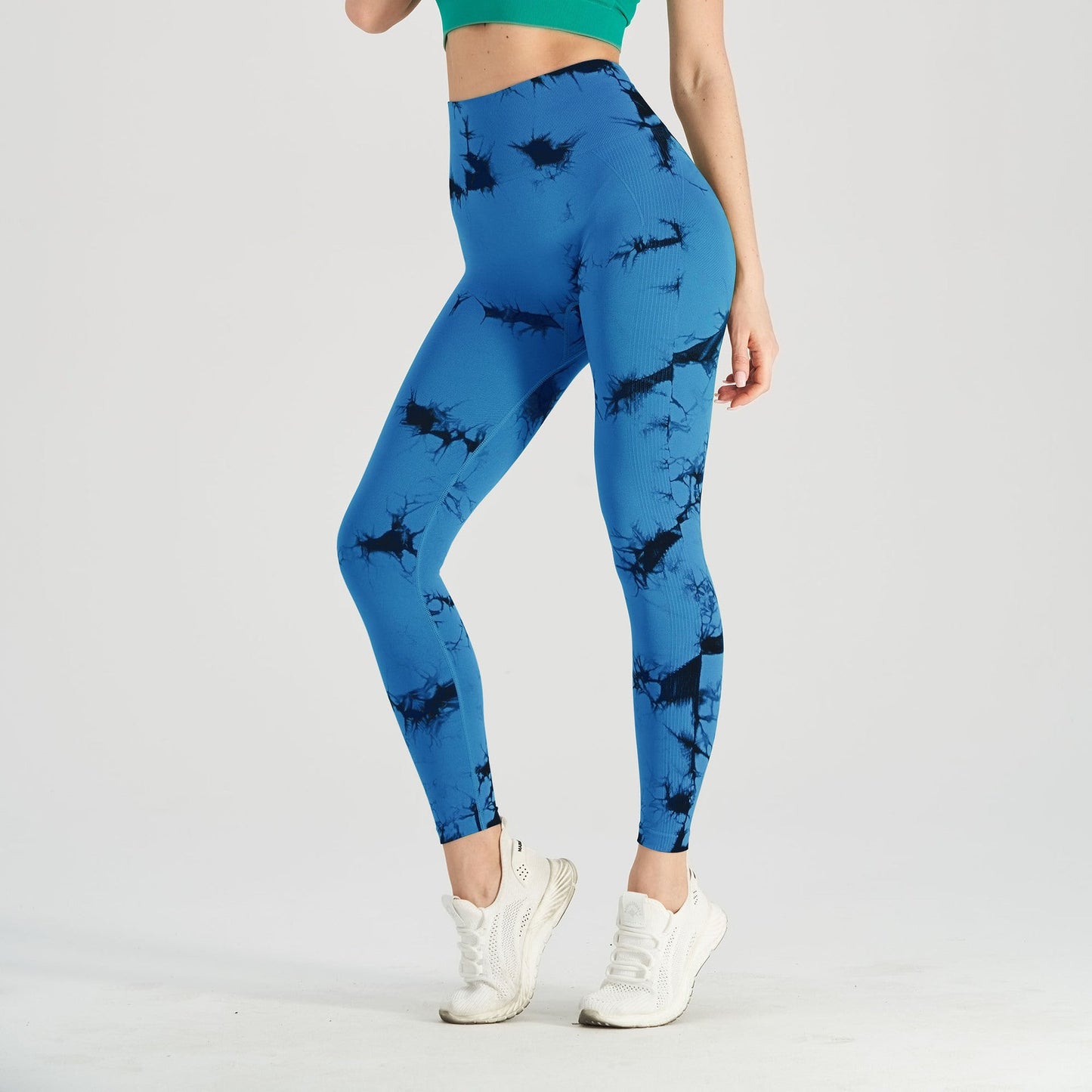 Women's seamless tie-dye yoga leggings by FitiqueFit, black and blue knitted high-waist leggings for comfortable activewear.