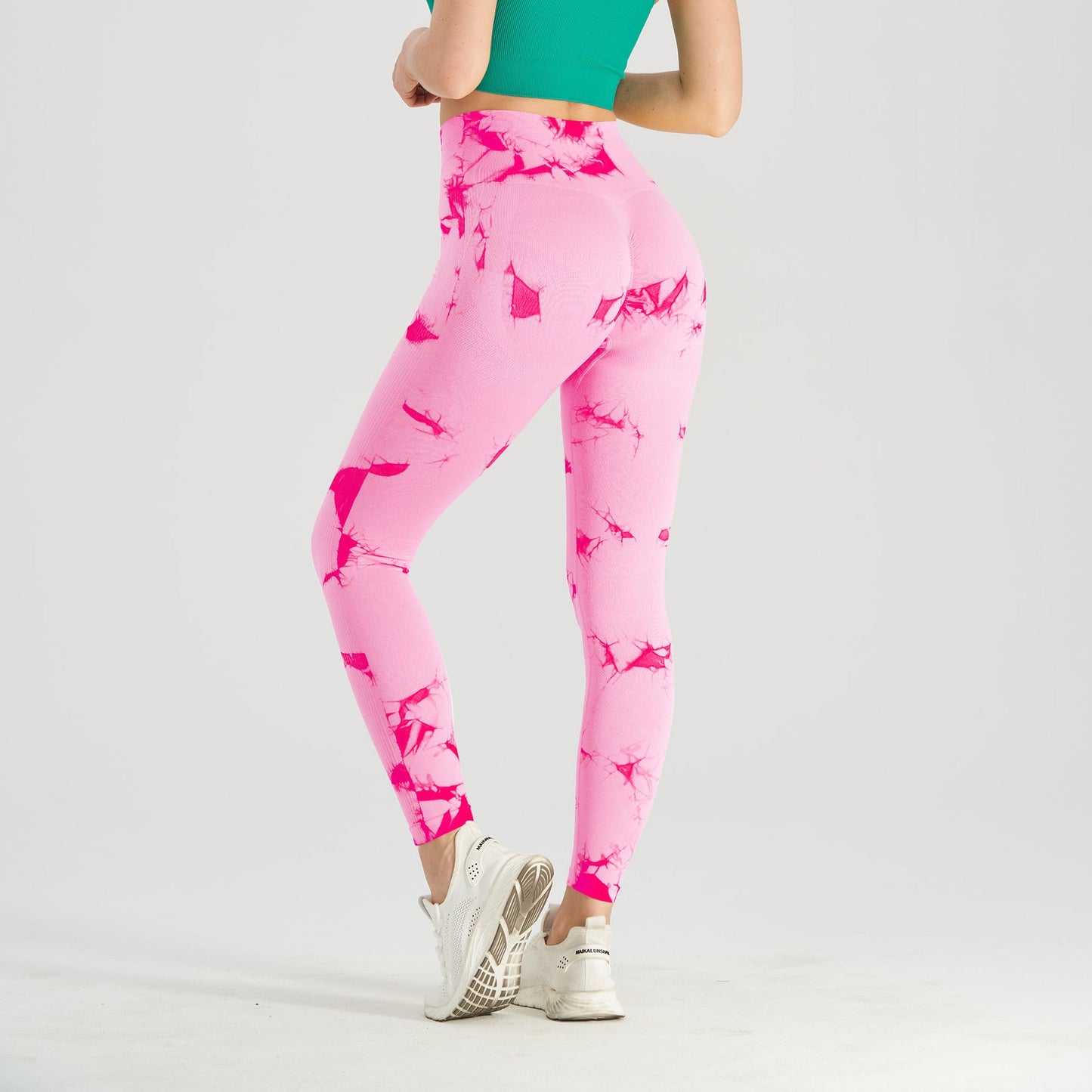 Women's seamless tie-dye yoga pants by FitiqueFit, black and blue knitted high-waist leggings for activewear and comfort.