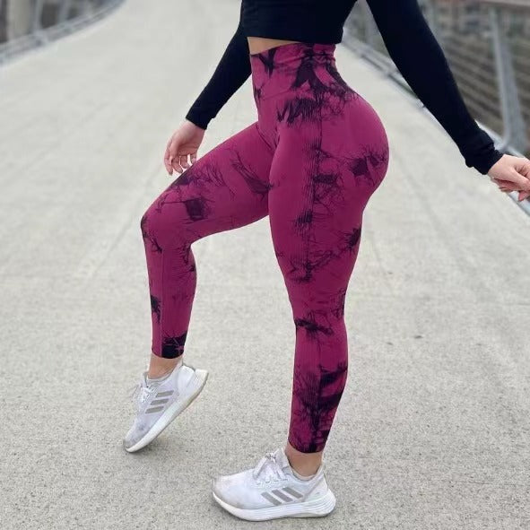 Black and blue women's seamless tie-dye yoga pants by FitiqueFit, high-waist knitted leggings for active wear.