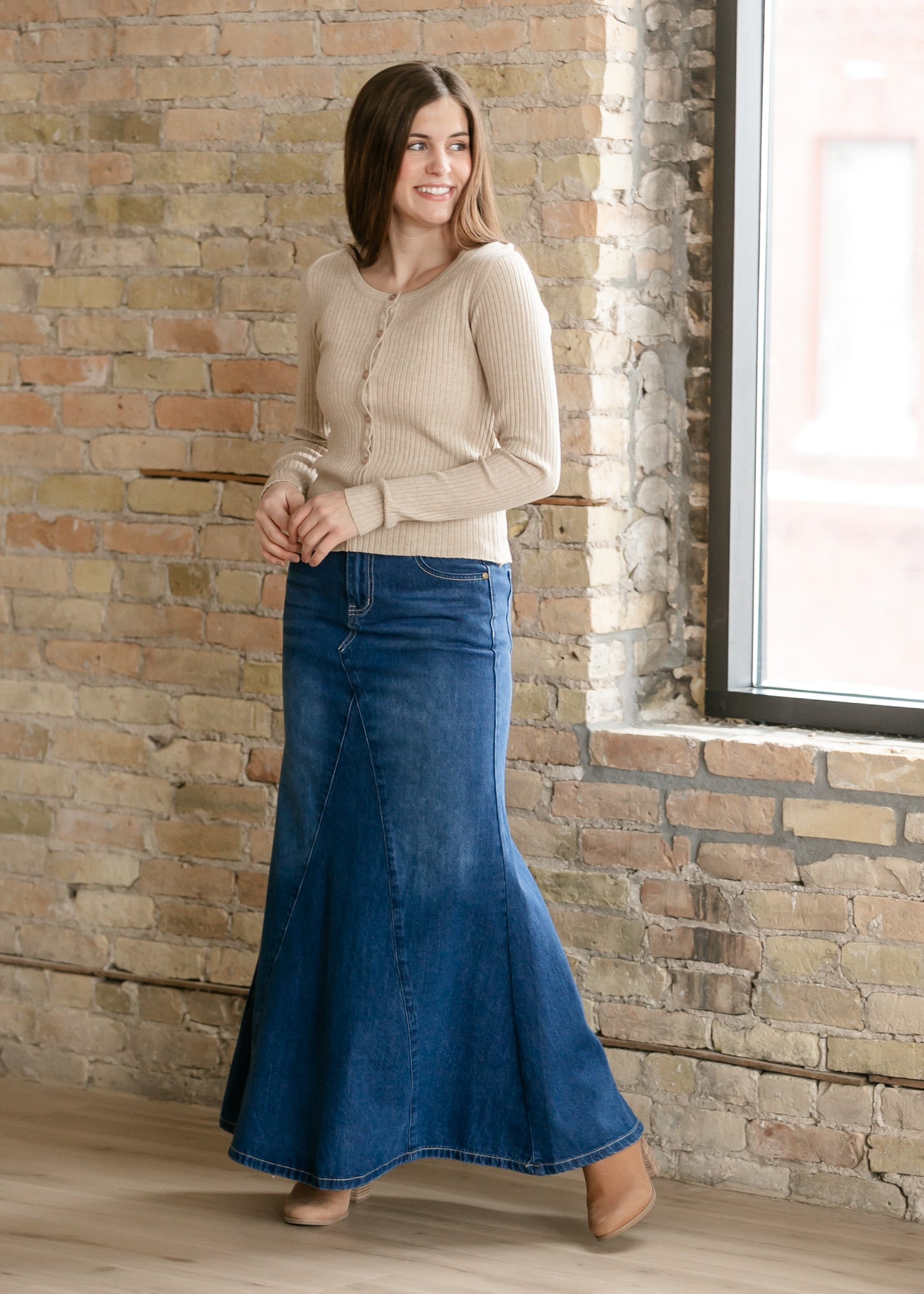 Inherit Co. Jennifer A-Line long denim skirt with a classic blue wash, featuring a high waist and flowing A-line silhouette.