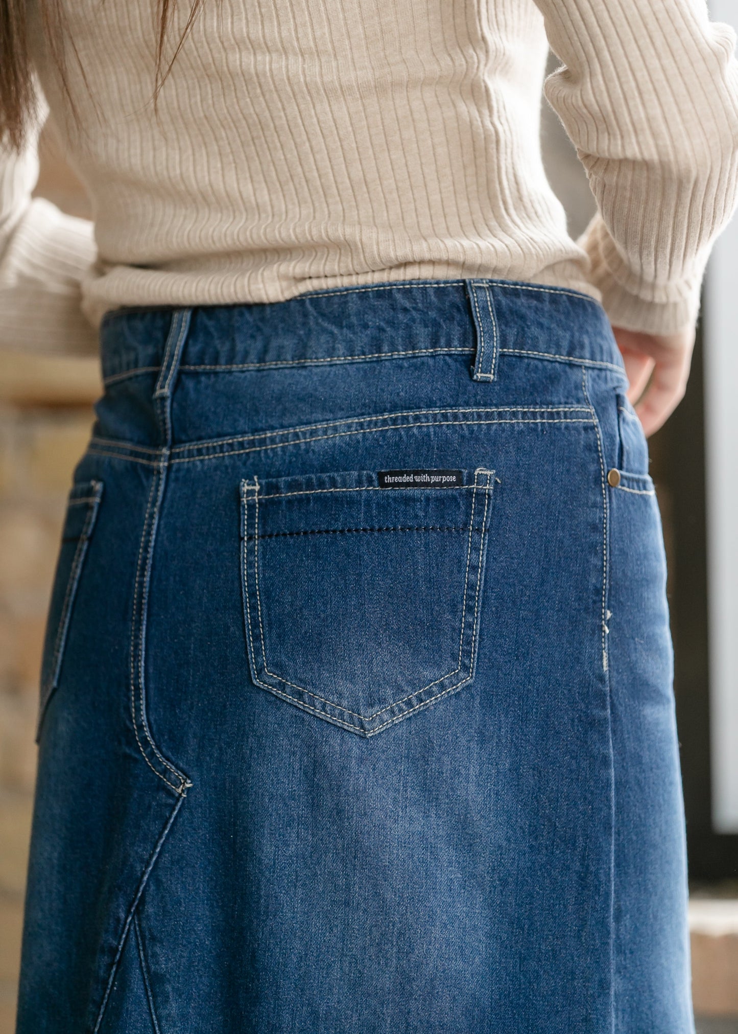 Inherit Co. Jennifer A-Line Long Denim Skirt, stylish blue denim skirt with a flattering A-line silhouette, shown on a model.