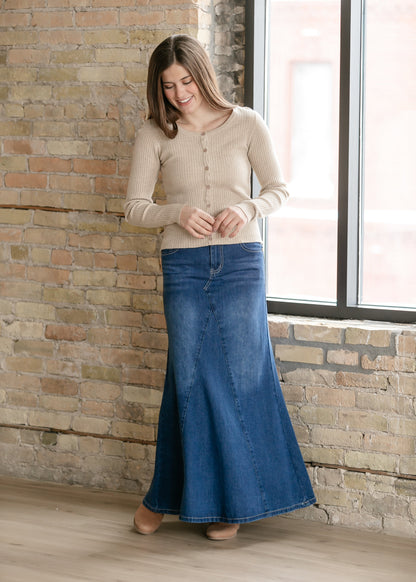 Inherit Co. Jennifer A-Line long denim skirt with a classic fit and visible stitching, styled with a casual top.