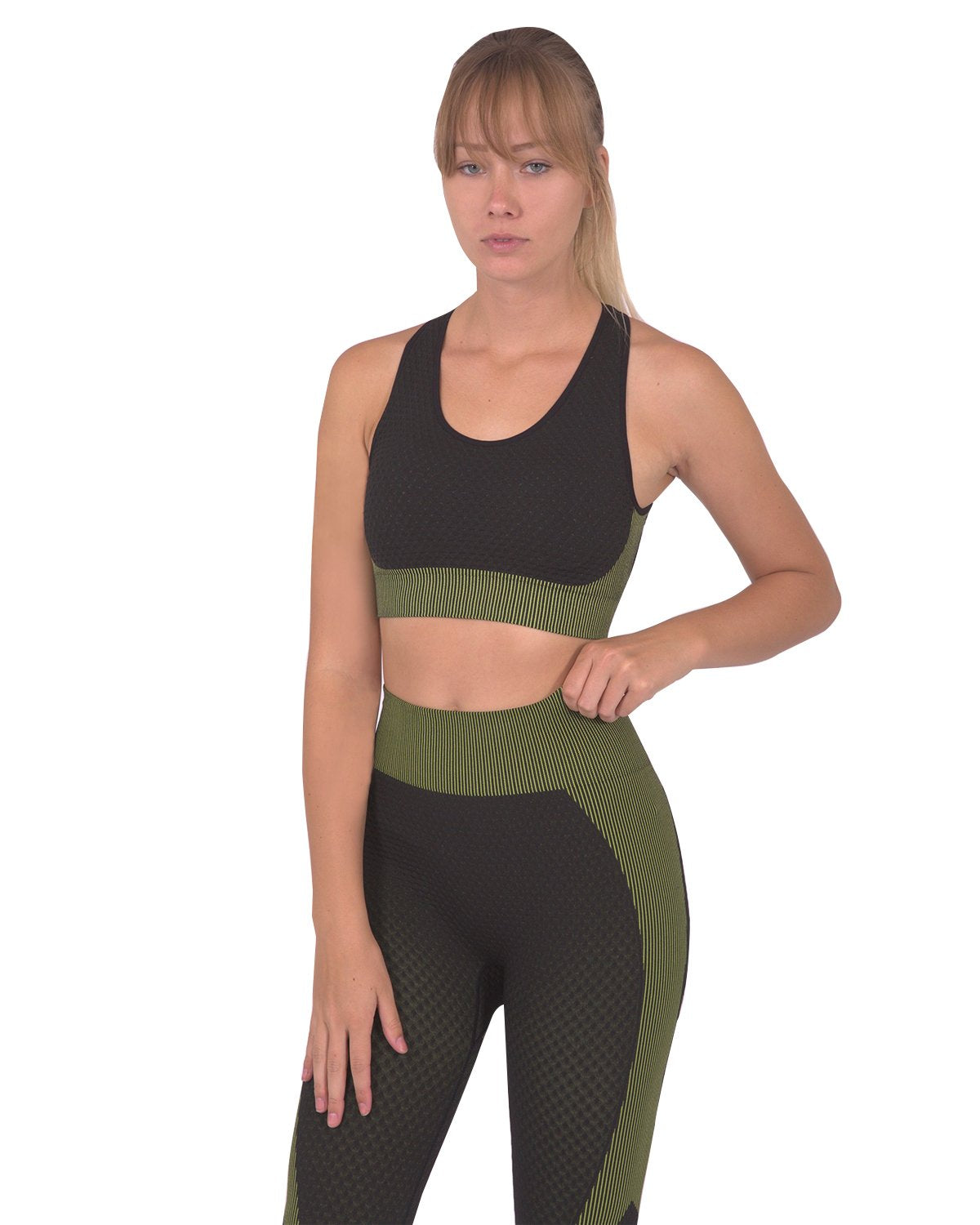 Black Lazurite Trois seamless sports bra with green accents, activewear designed for comfort and support during workouts.