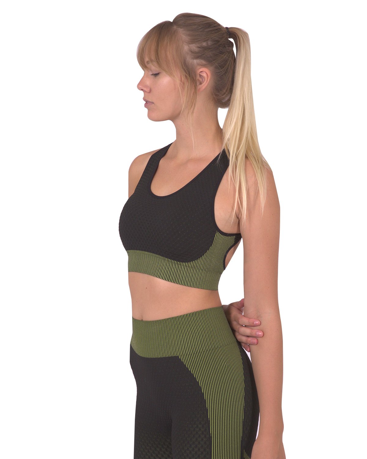 Lazurite Trois Seamless Sports Bra in black with green accents, designed for comfortable activewear and support during workouts.