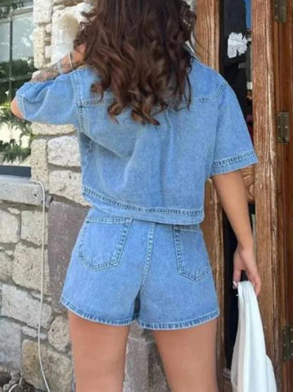 Women’s 2-piece denim streetwear set with short sleeve lapel jean top and asymmetrical denim shorts, stylish casual outfit.
