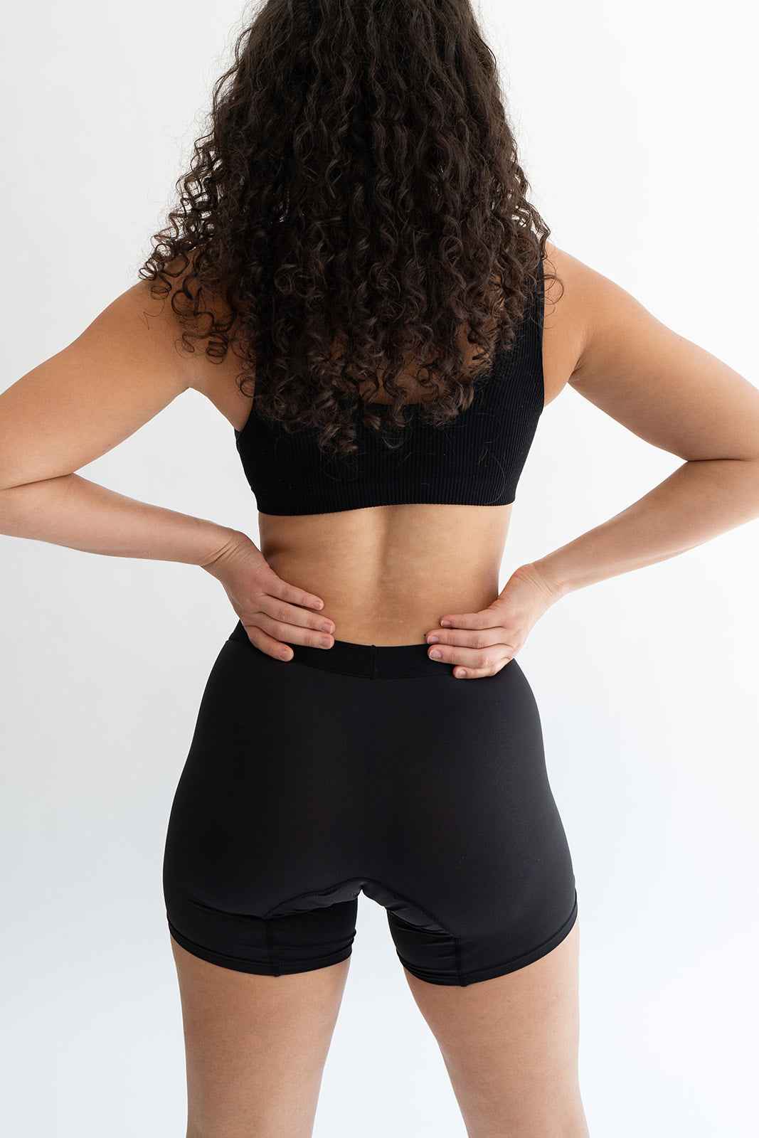 Black boxer briefs by Monthly, showing snug fit and comfortable waistband on a plain background.