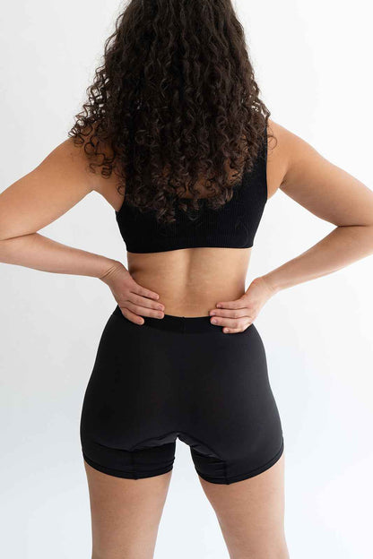 Black boxer briefs by Monthly, showing snug fit and comfortable waistband on a plain background.
