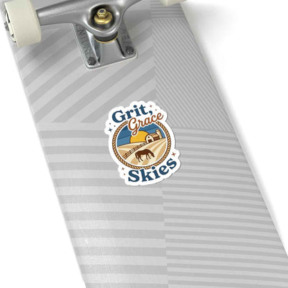 White Grit & Grace Skies cowgirl ranch sticker on paper, featuring western style design with bold lettering and artistic western-themed graphics.