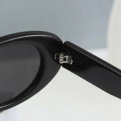 Black oval sunglasses with UV protection from Redemption by Ashley North, featuring a sleek, one-size design.