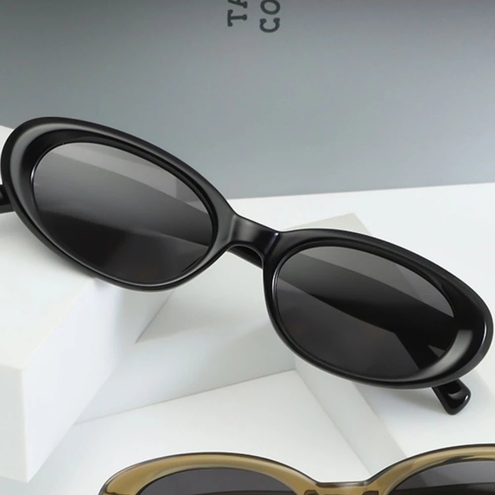 Black oval sunglasses with UV protection from Redemption by Ashley North, stylish and suitable for all face shapes.