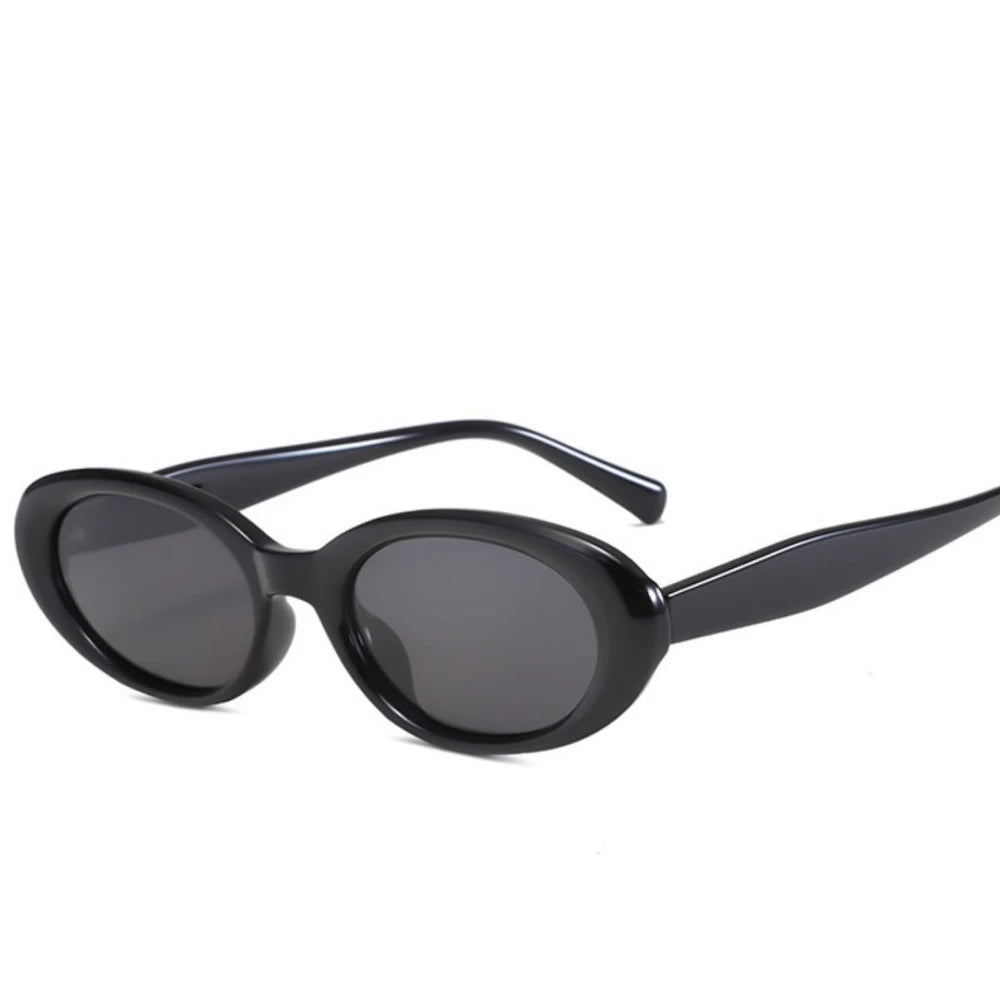 Black oval sunglasses with UV protection from Redemption by Ashley North, featuring a sleek, one-size design.
