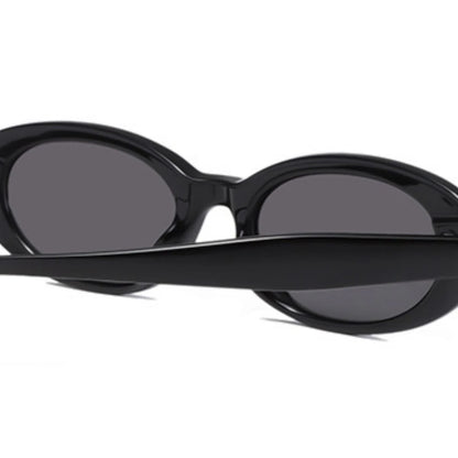 Black oval sunglasses by Redemption By Ashley North with UV protection and a one-size-fits-all design.