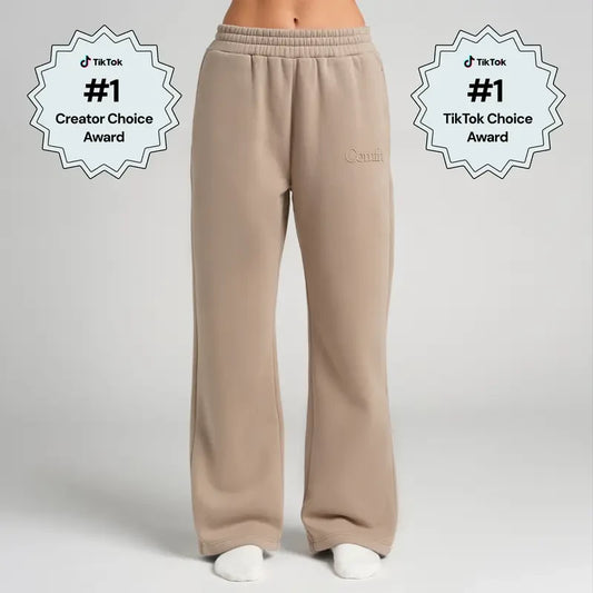 Chocolate milk-colored minimalist straight leg sweatpants by Redemption By Ashley North, shown on a neutral background.