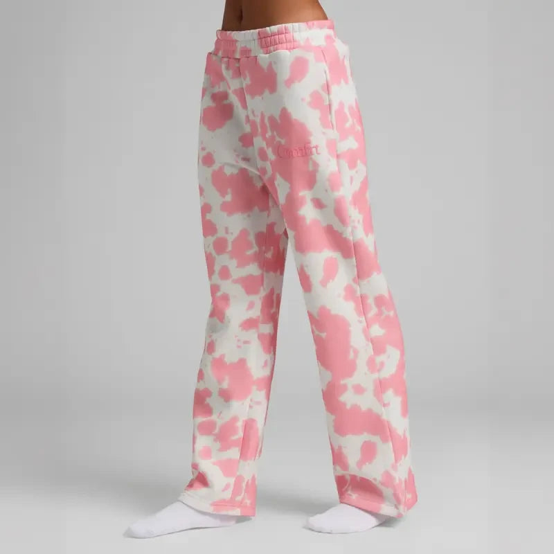 Chocolate milk-colored minimalist straight leg sweatpants by Redemption By Ashley North, showing relaxed fit and soft fabric.
