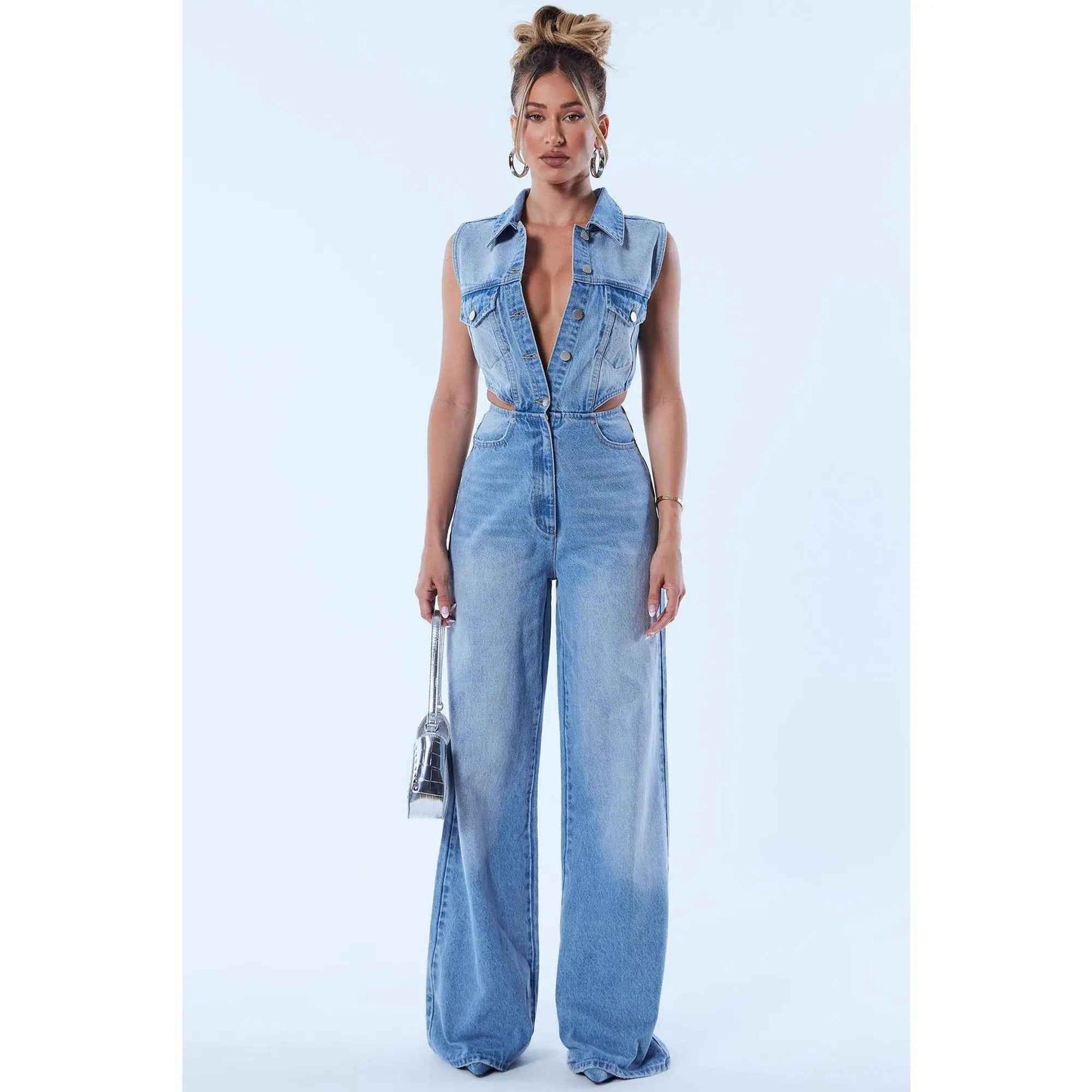Redemption by Ashley North Baylin denim jumpsuit in light wash, featuring a stylish, fitted design with shoulder straps and front pockets.