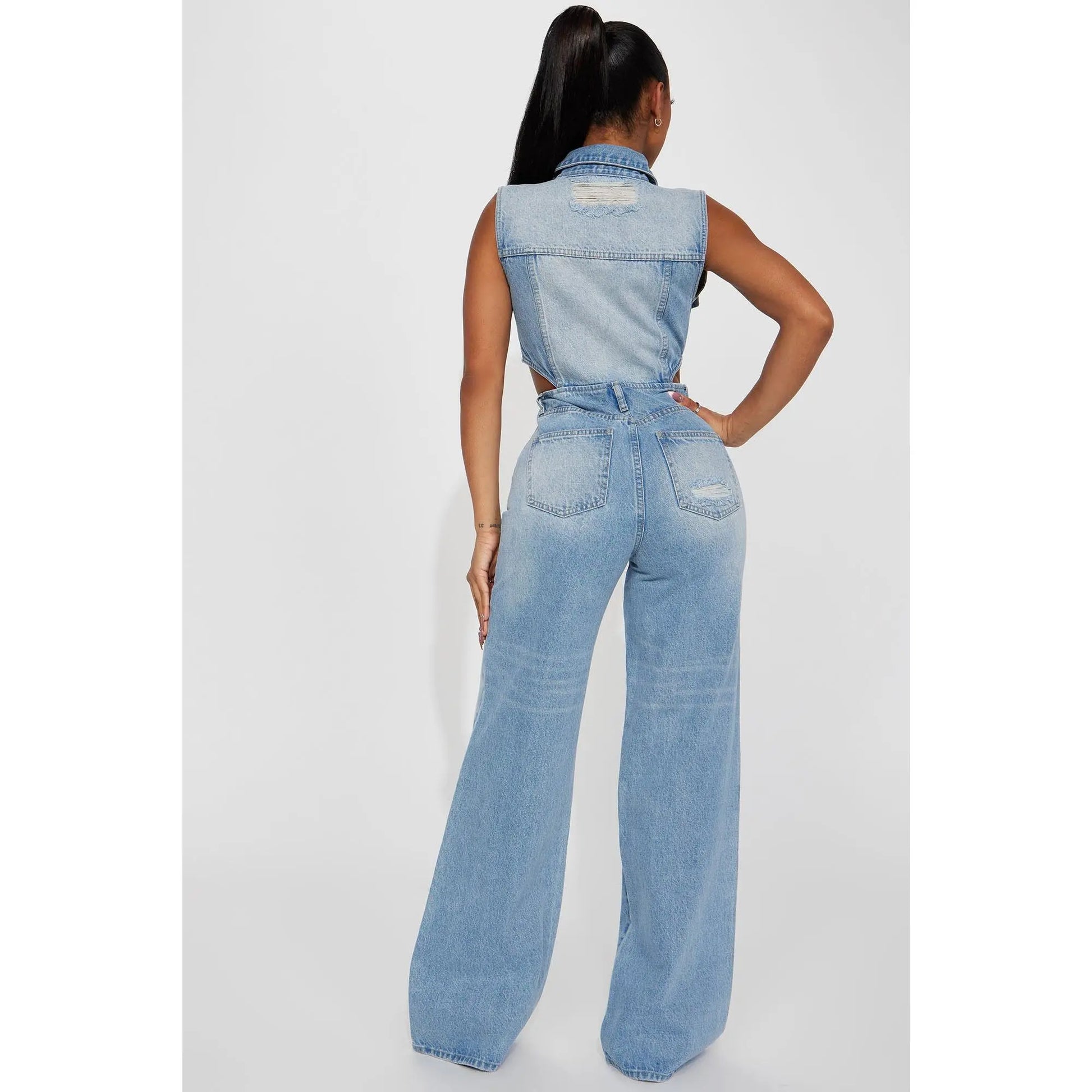 Redemption By Ashley North Baylin denim jumpsuit in light wash, featuring a stylish, casual fit and classic denim details.