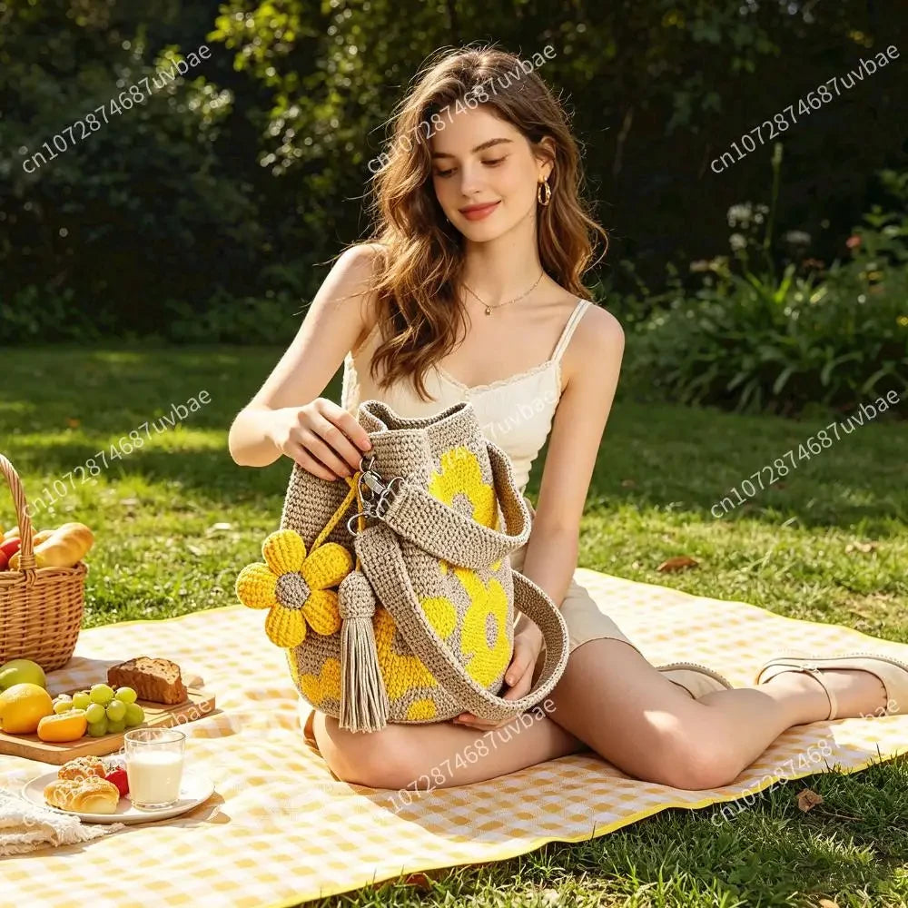 Yellow bohemian crochet floral tote bag by Redemption by Ashley North with intricate floral patterns and woven handles.