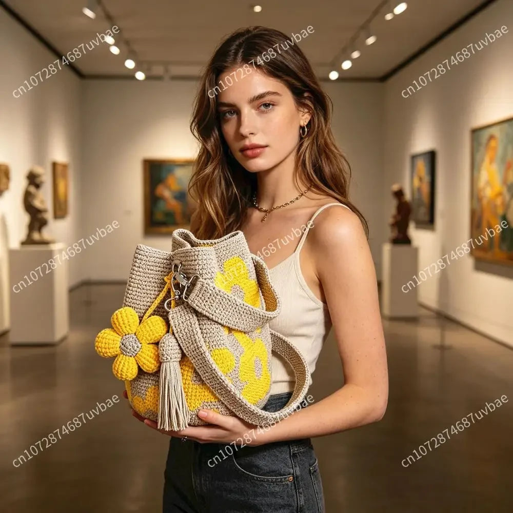 Yellow Bohemian crochet floral tote bag by Redemption by Ashley North with intricate floral patterns and woven shoulder straps.