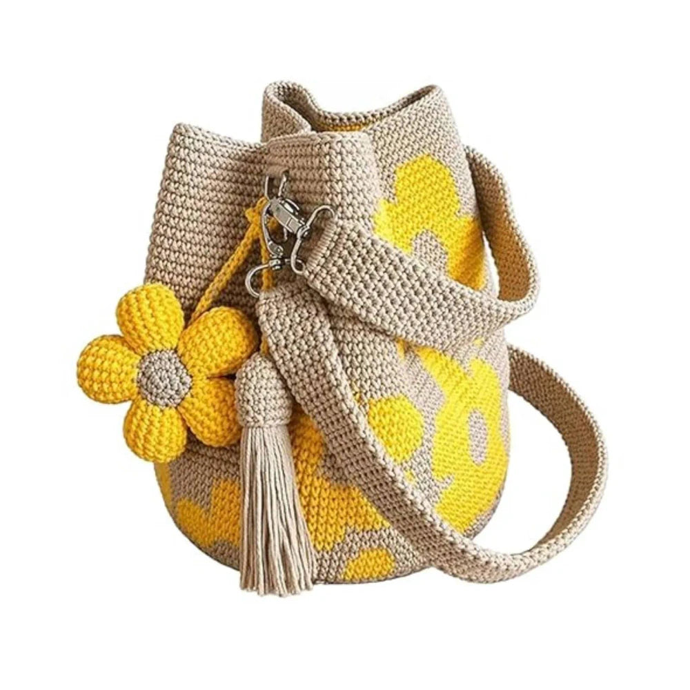 Yellow Bohemian crochet floral tote bag by Redemption by Ashley North with intricate floral patterns and sturdy handles.