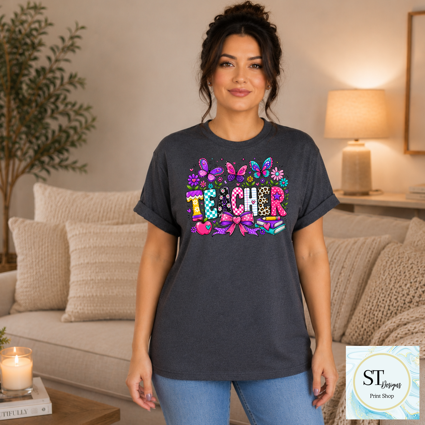 Colorful teacher graphic crewneck sweatshirt in sand color with vibrant educational-themed design, made by ST Designs Store.