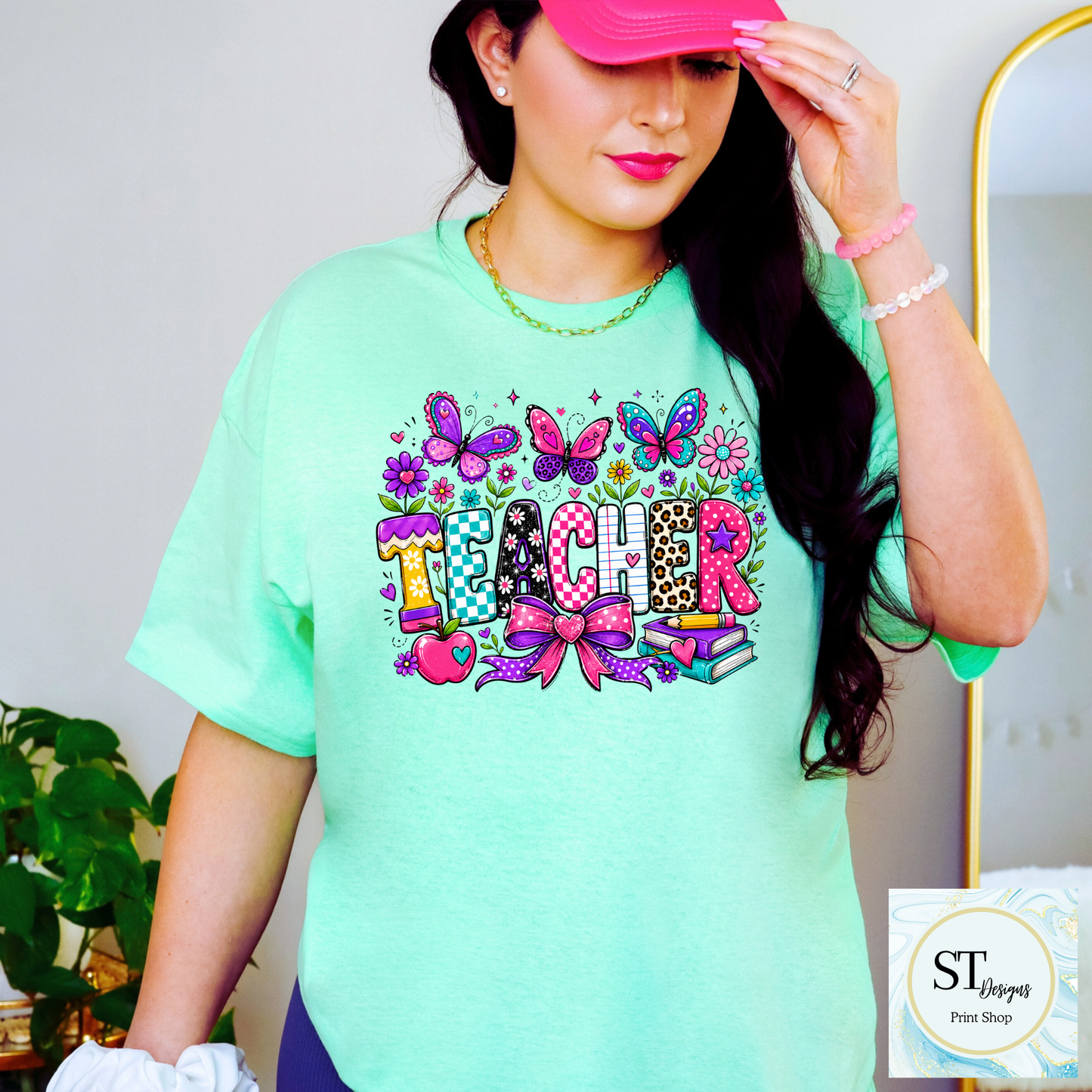 Colorful teacher graphic crewneck sweatshirt in sand color, featuring vibrant educational-themed design by ST Designs Store.