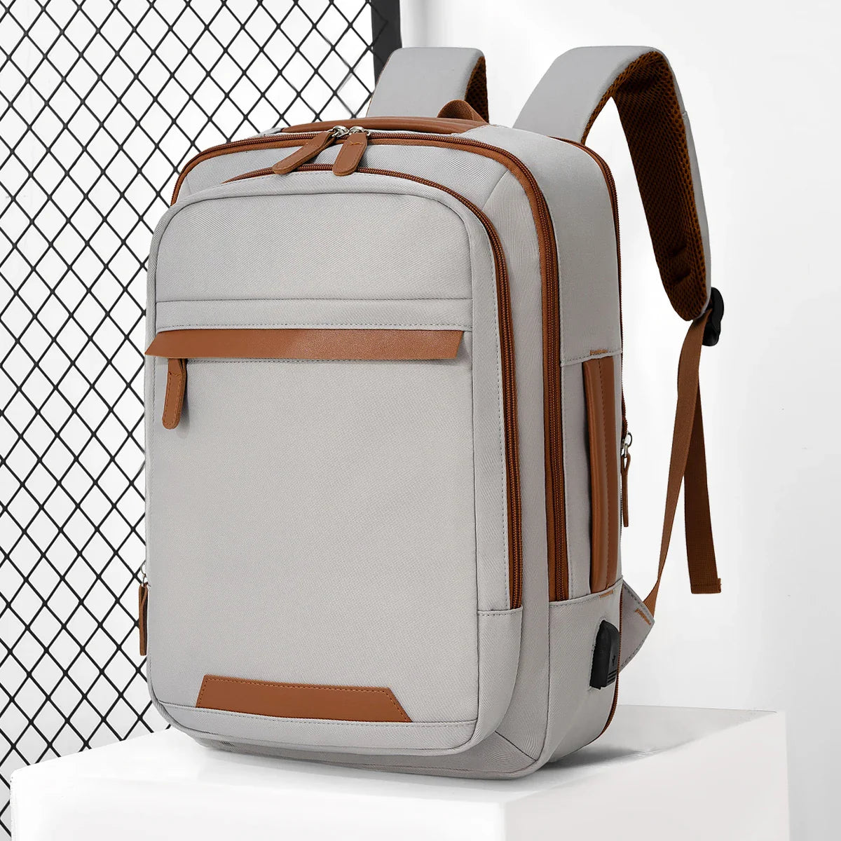 Black waterproof USB rechargeable backpack from Stone's Store with large laptop compartment, ideal for men and women.