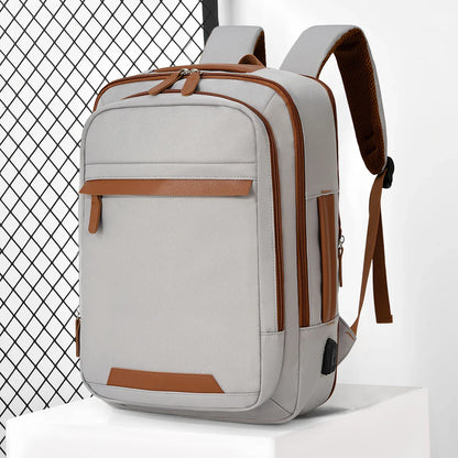 Black waterproof USB rechargeable backpack from Stone's Store with large laptop compartment, ideal for men and women.