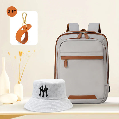 Waterproof black USB rechargeable backpack for men and women, large laptop compartment, unisex school and youth bag.