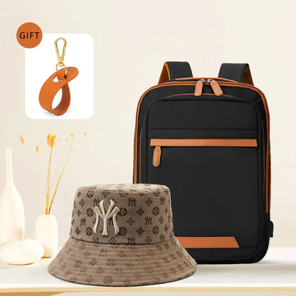 Black waterproof USB rechargeable backpack for men and women, large laptop compartment, unisex school and youth bag.