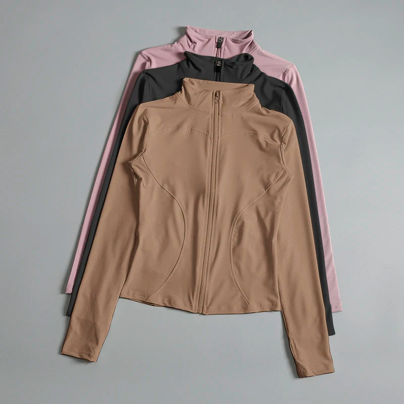 Women’s long sleeve zip fitness yoga shirt and sports jacket from Stone's Store, ideal for gym workouts and running.