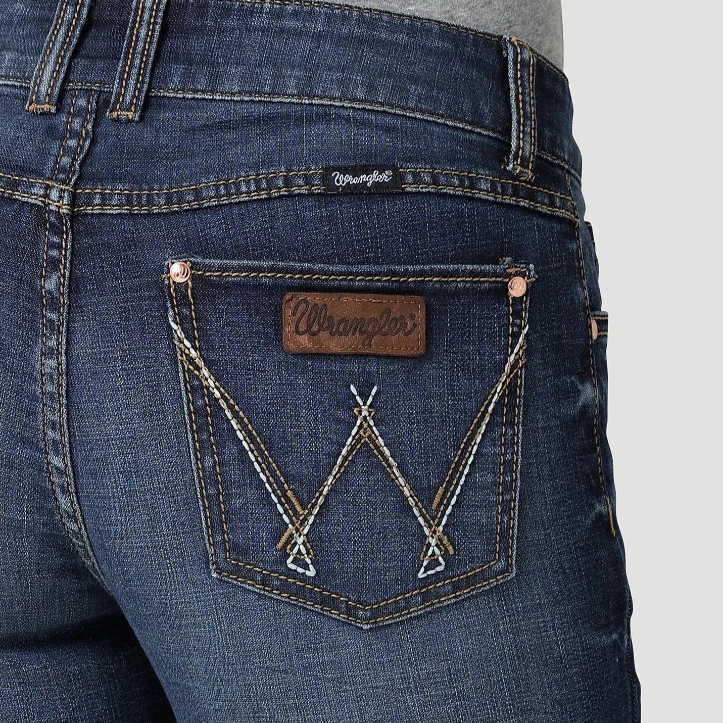 Retro Mae Wrangler women's jeans from Summerdale Western Store, featuring classic denim style and a high-waist fit.